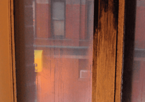 Condensation on a window in a cold home.