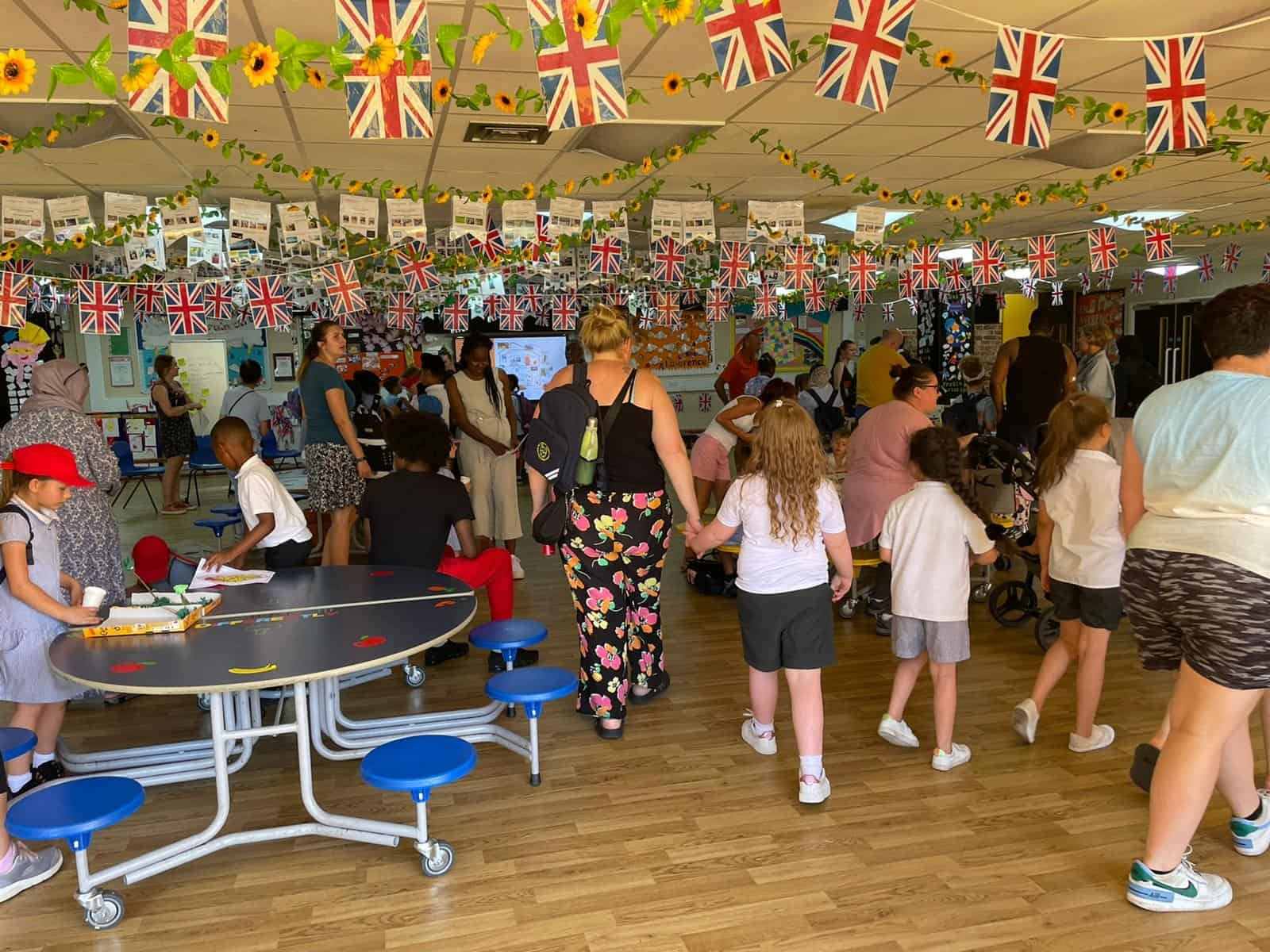 A school hall filled with students, parents and teachers for an energy awareness event