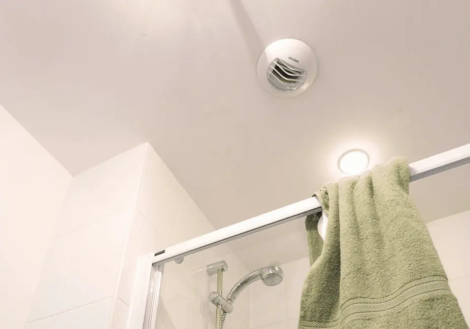 A mechanical ventilation unit installed in a bathroom. They look rather like extractor fans.