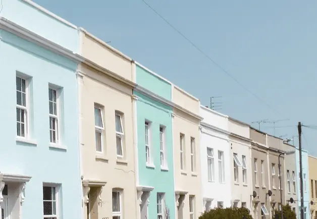A row of colourful houses in a C19 terrace in Bristol