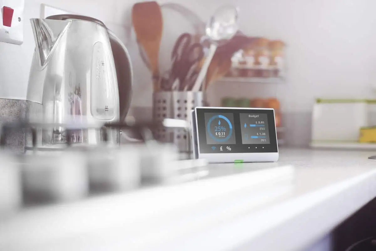 A smart meter on the counter of a kitchen.