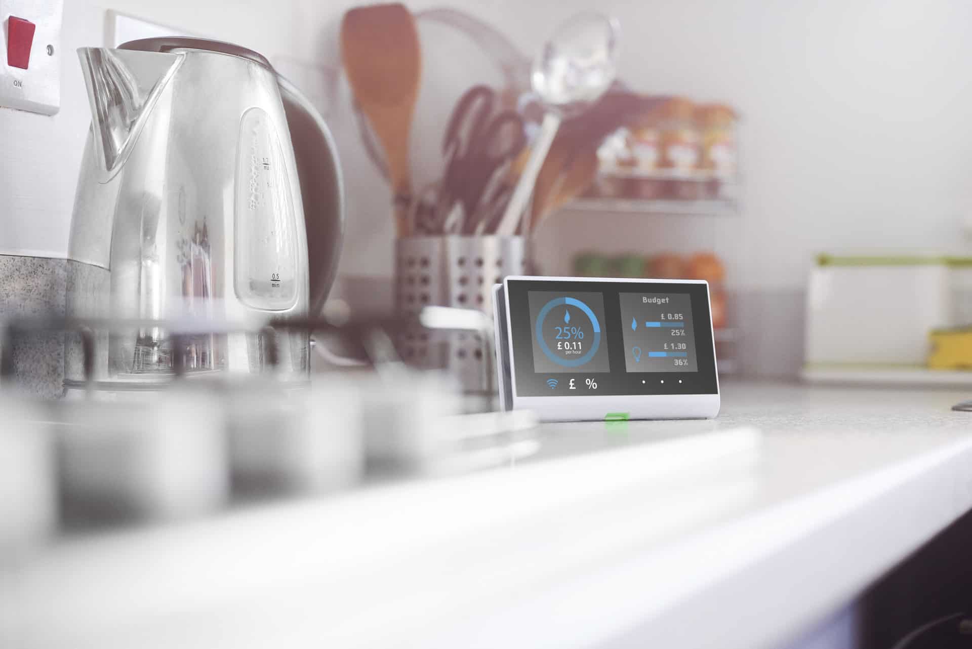 A smart meter on the counter of a kitchen.