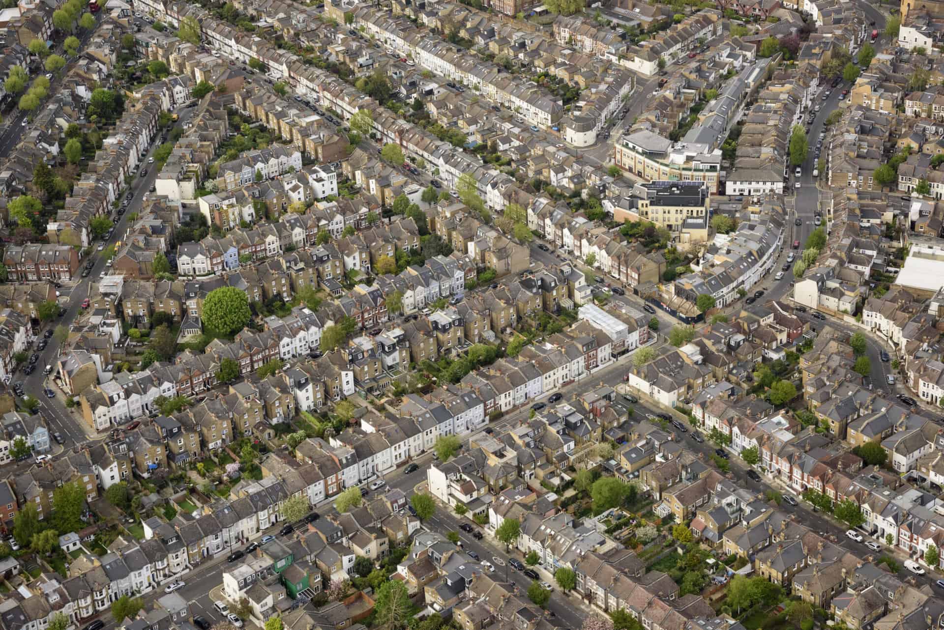 Aerial view over Fulham, London showing large expanse of Victorian and Edwardian terraced housing
