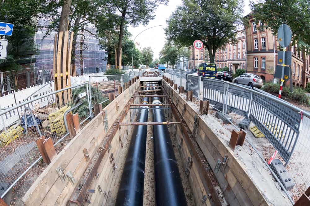 A view down a street in Germany where district heating pipework is being laid.