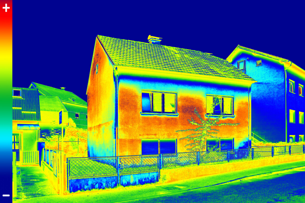 Thermal image of a house showing heat loss from the walls