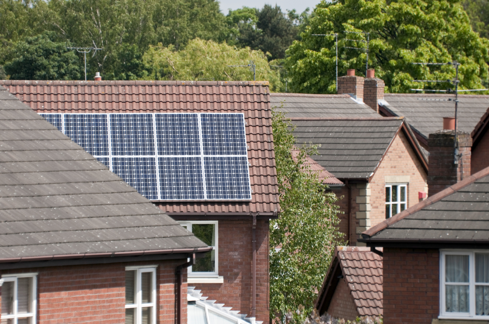 Solar panels on the rof of a family home. 