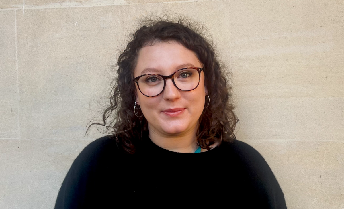 Headshot of a woman wearing glasses.