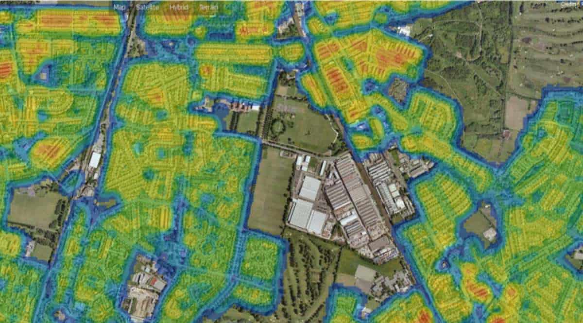 A satelitte map with areas outlined in blue and filled in with shades of yellow orange and red.