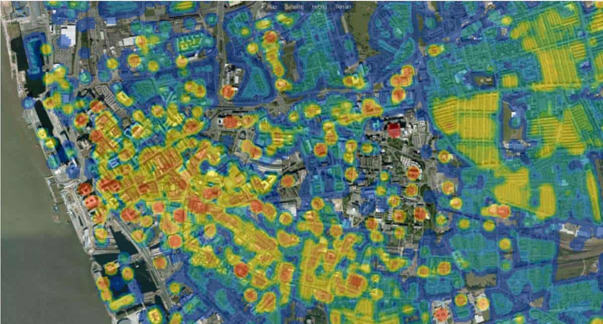 A satellite map of liverpool. It is mostly highlighted in blue with circles of yellow and orange.
