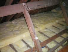 Showing a double layer of insulation, with the top layer laid at right angles to the layer below.