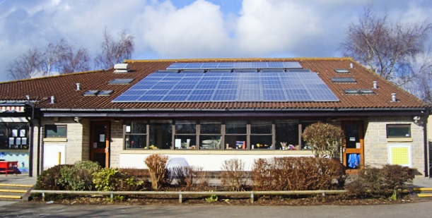 Solar panels on the roof of a school building.