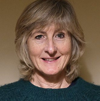 Headshot of a woman smiling.