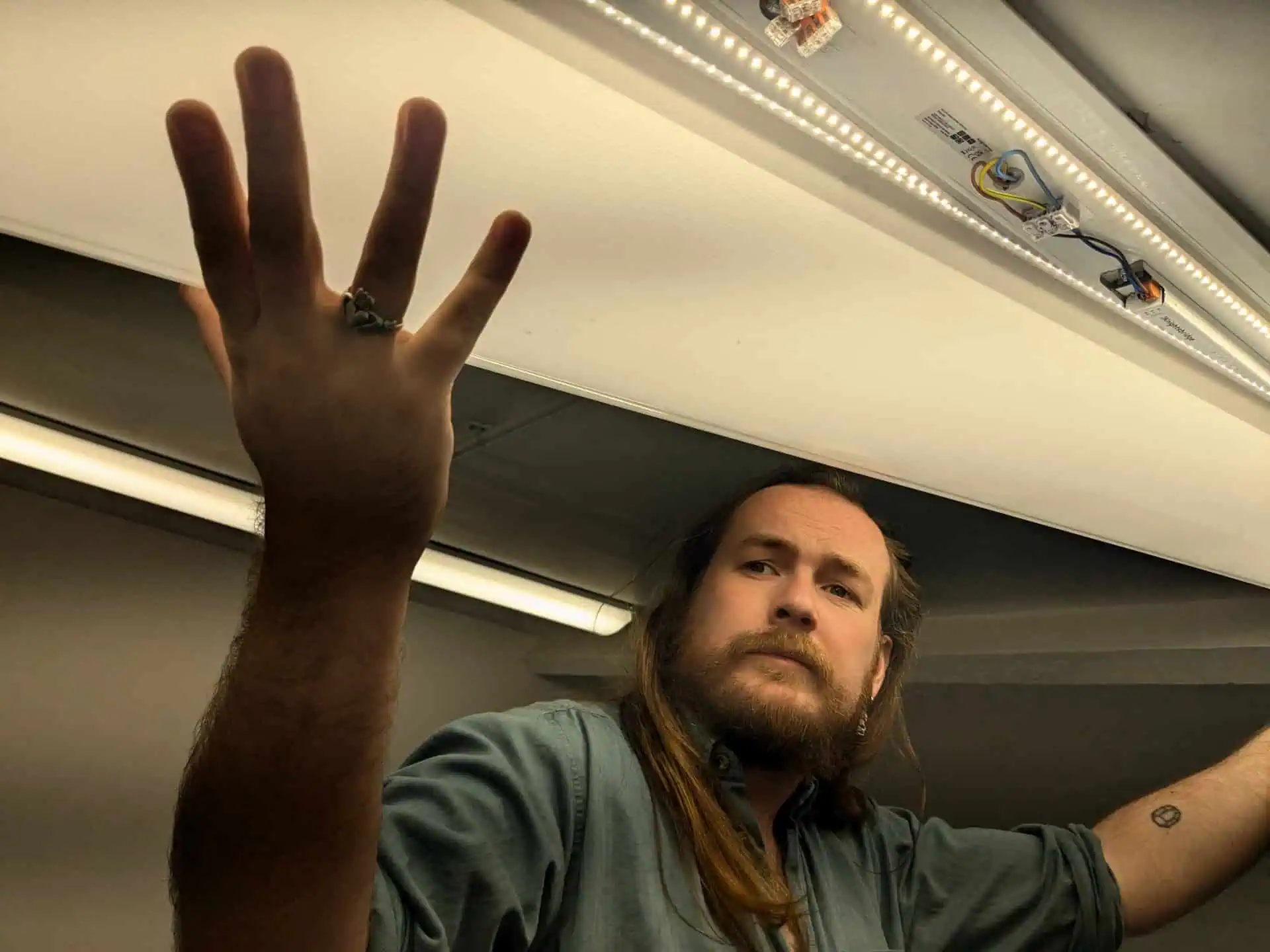 A man installs LED lights.