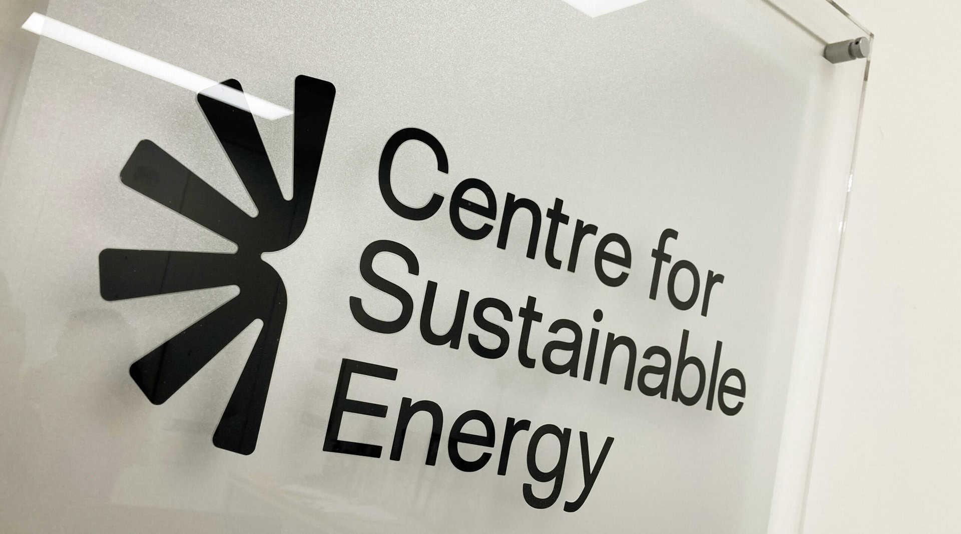 Wall-mounted sign with the logo for the Centre for Sustainable Energy