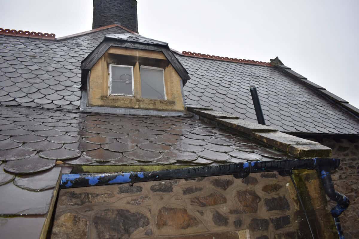 Gutters running around the roof of a home.