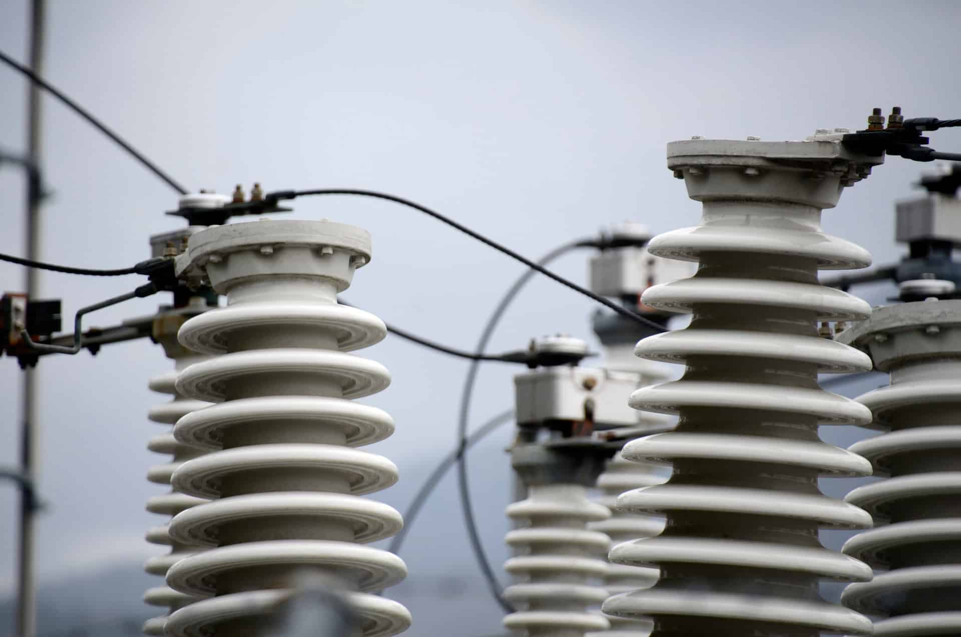Close up of ceramic insulators at an electricity substation