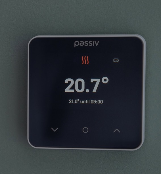 Image shows the Passiv Smart Thermostat on a wall