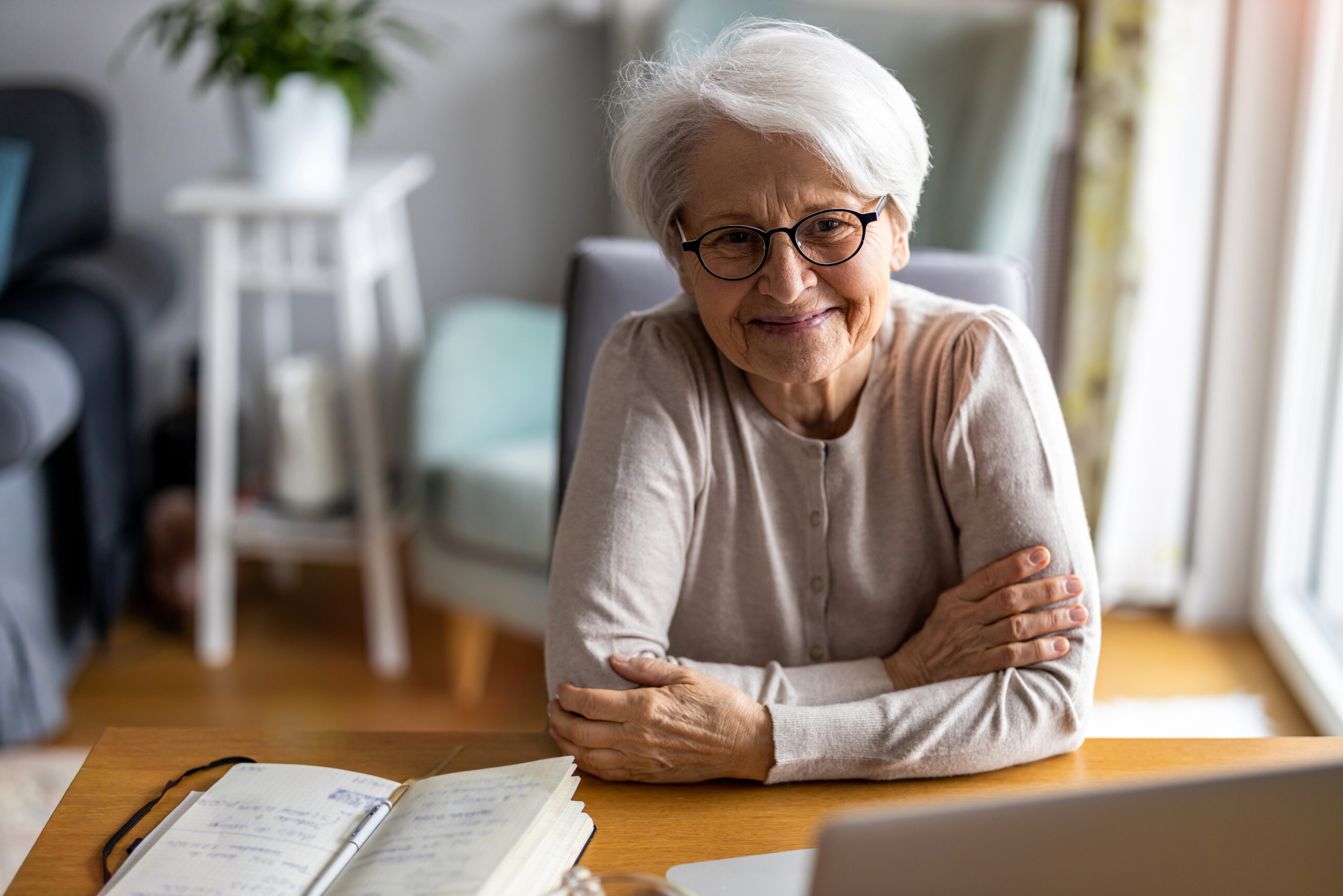 Older woman smiling at home.